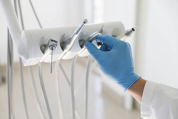 Professional Tooth Extraction technician working in Lake County County, MI